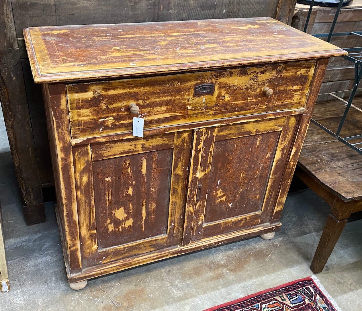 A 19th century East European painted pine side cabinet, width 108cm, depth 47cm, height 96cm